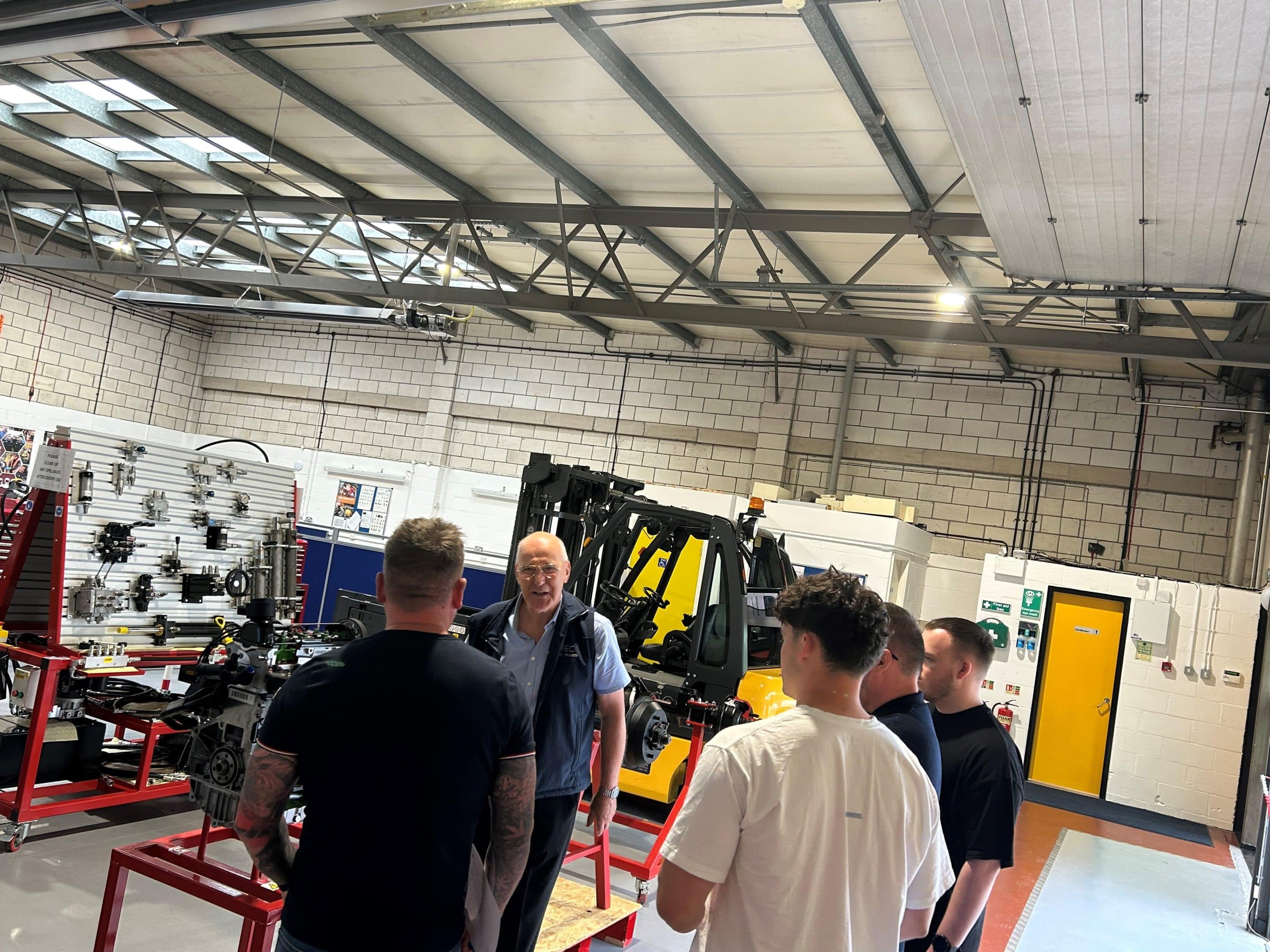 Trainer talking to visitors during open day at F-TEC training centre
